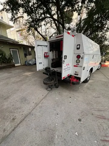 Magnet Plumbing service vehicle on-site for Grease Trap Cleaning in Leinbachs